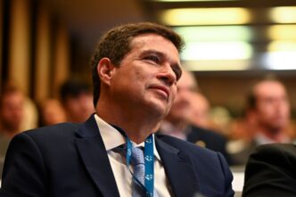 Roberto Campos Neto em evento, ex-presidente do Banco Central, avalia cenário financeiro e risco do Banco Master.