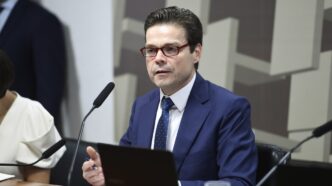 Nilton David, diretor de política monetária do Banco Central, em evento nos EUA, discutindo dados econômicos e a não reação a ruídos.