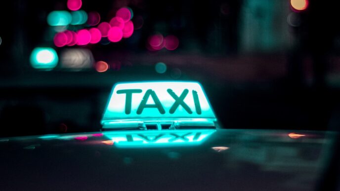 Taxistas em uma rua urbana, com a medida aprovada pela Câmara em destaque.
