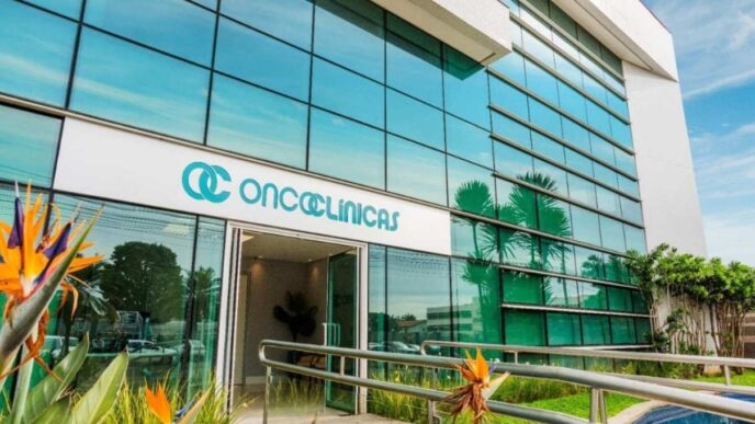 Logotipo da empresa Oncoclínicas em ambiente corporativo.