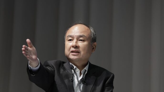 Logotipo do SoftBank Group e representação de chips de inteligência artificial.